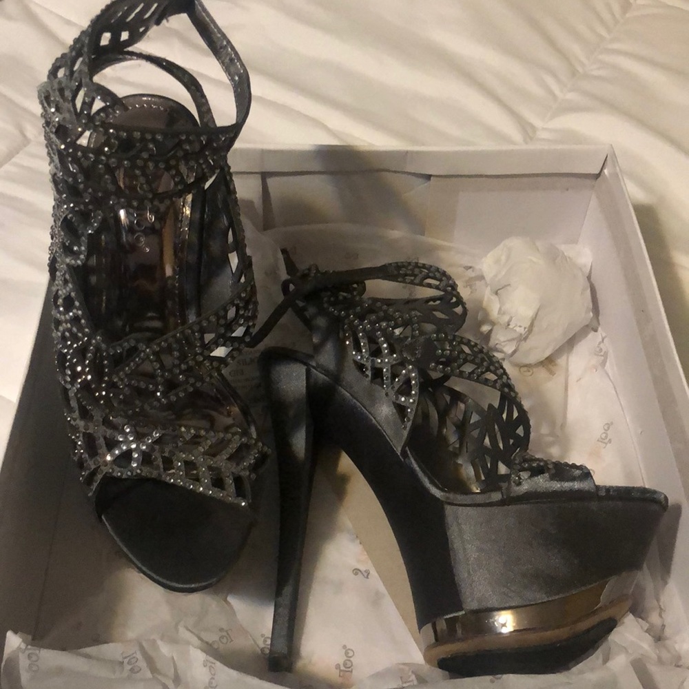 Dressy heel with high ankle strap.